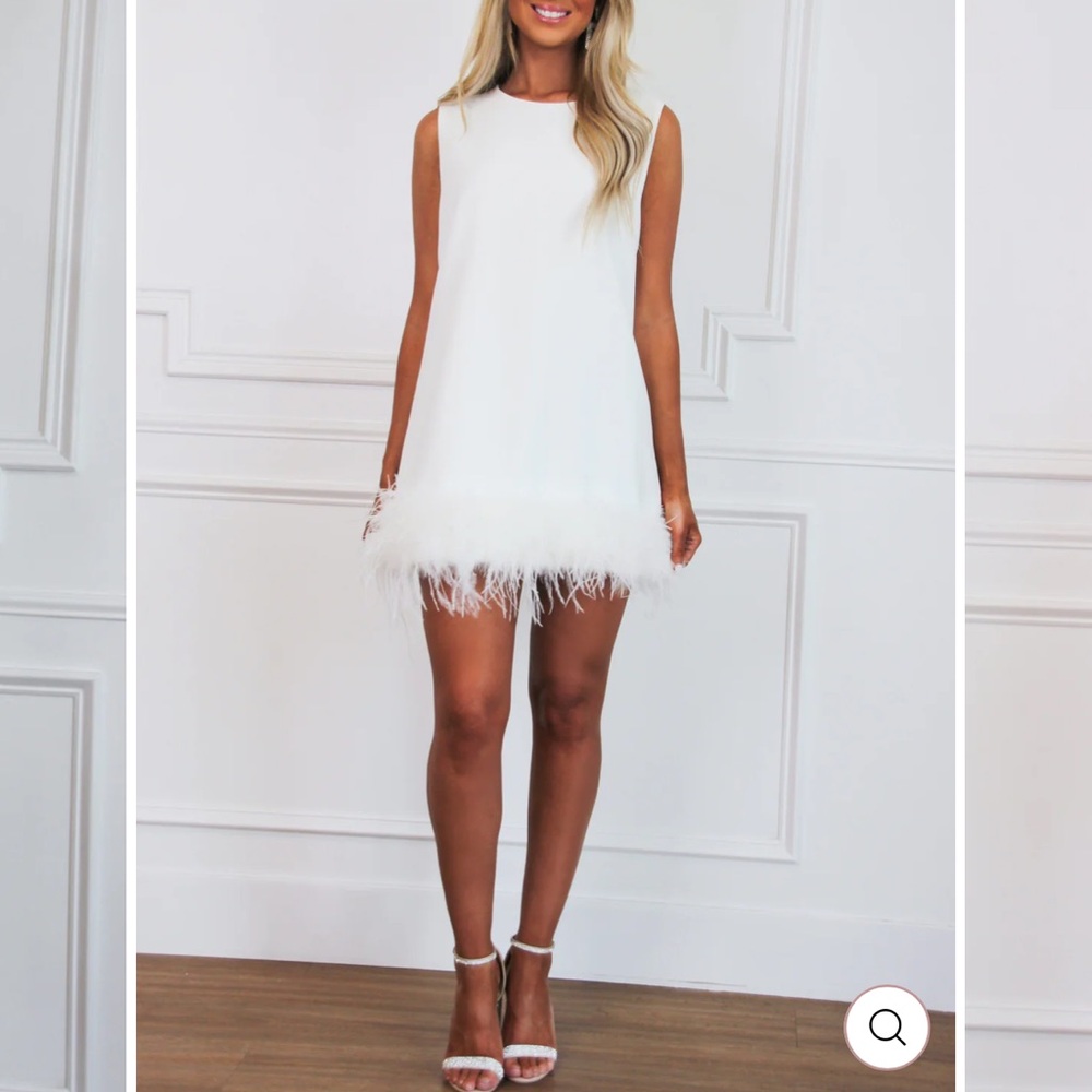 White sleeveless dress with feather trim